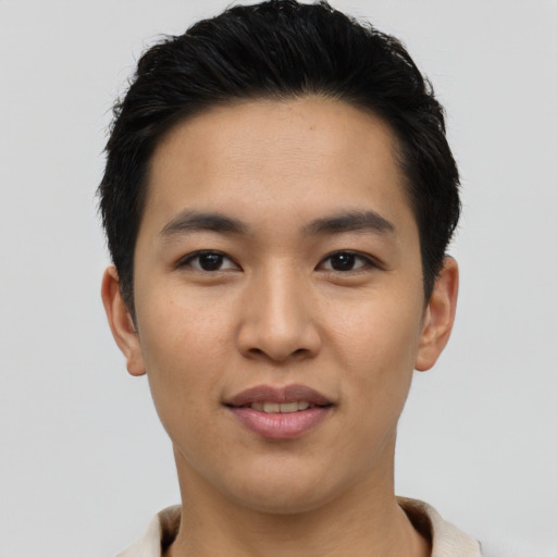Joyful asian young-adult male with short  black hair and brown eyes