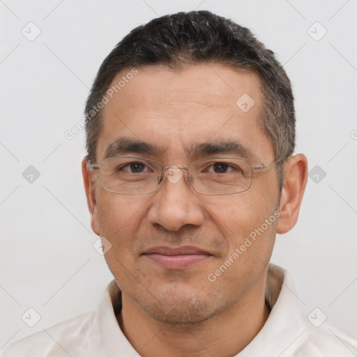 Joyful white adult male with short  brown hair and brown eyes