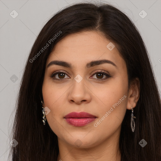 Joyful latino young-adult female with long  brown hair and brown eyes