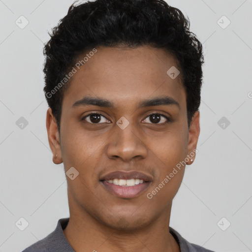 Joyful black young-adult male with short  black hair and brown eyes