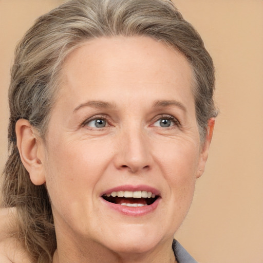 Joyful white adult female with medium  brown hair and grey eyes