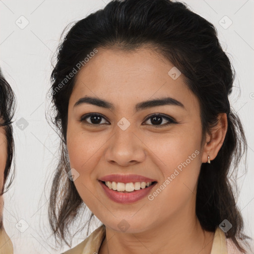 Joyful latino young-adult female with medium  brown hair and brown eyes