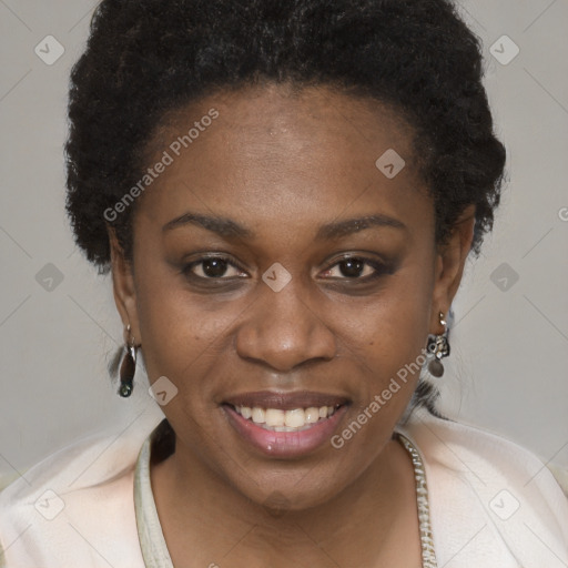 Joyful black young-adult female with short  brown hair and brown eyes