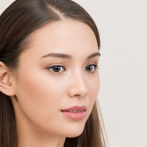 Neutral white young-adult female with long  brown hair and brown eyes