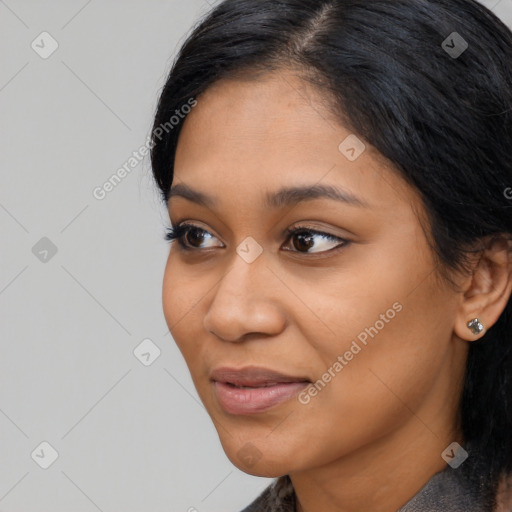 Joyful latino young-adult female with medium  black hair and brown eyes