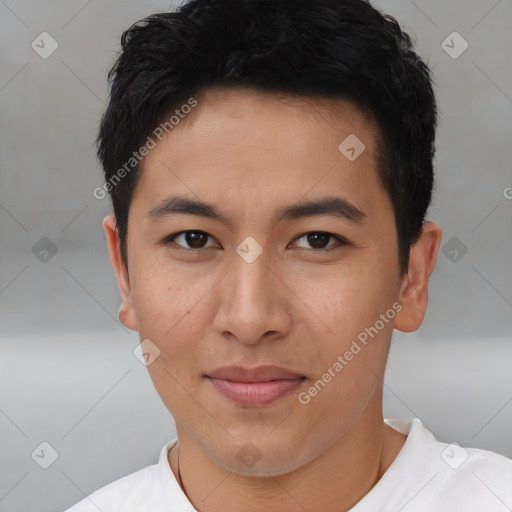 Joyful asian young-adult male with short  brown hair and brown eyes