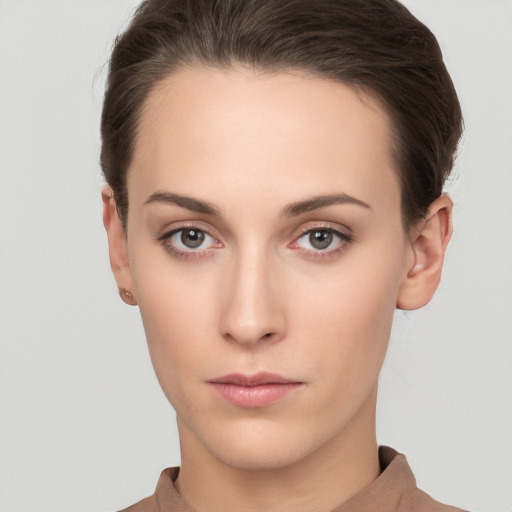 Neutral white young-adult female with short  brown hair and brown eyes