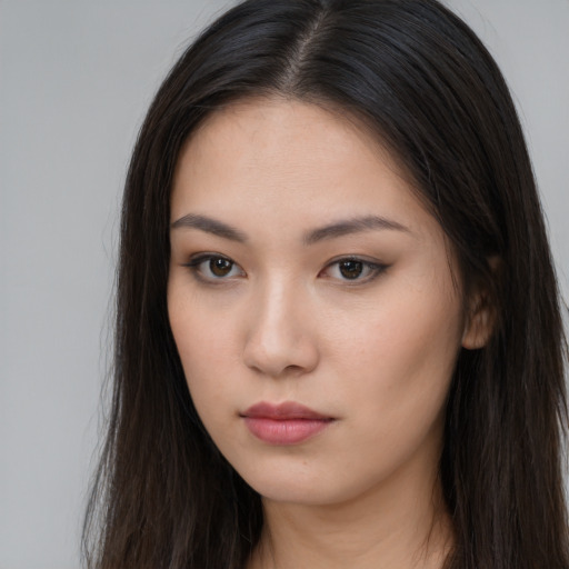 Neutral asian young-adult female with long  brown hair and brown eyes