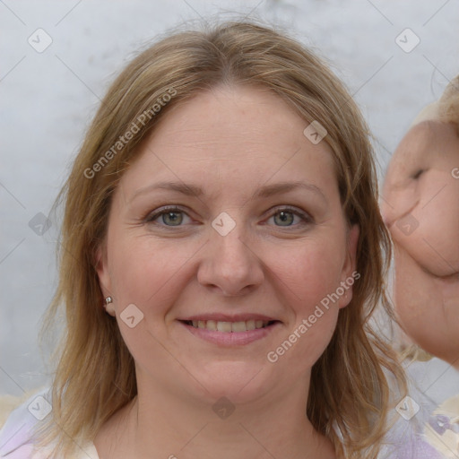 Joyful white young-adult female with medium  brown hair and blue eyes