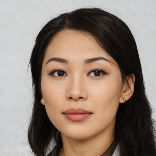 Neutral latino young-adult female with long  black hair and brown eyes