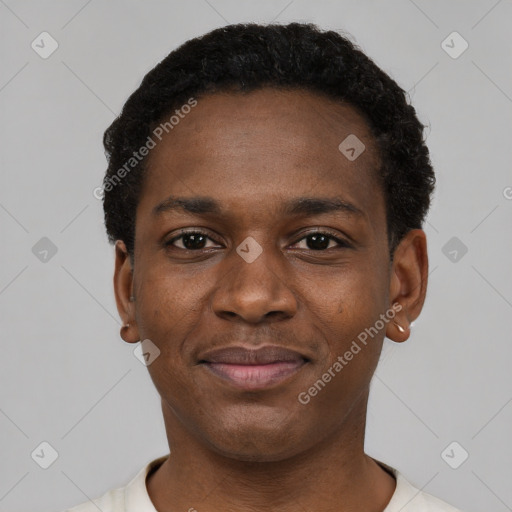 Joyful black young-adult male with short  black hair and brown eyes