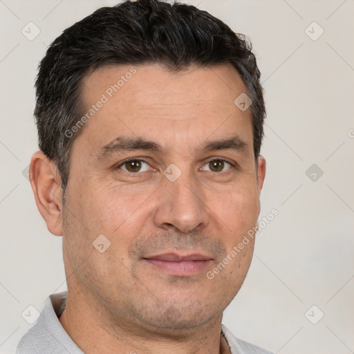 Joyful white adult male with short  brown hair and brown eyes