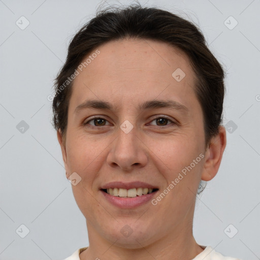 Joyful white young-adult female with short  brown hair and brown eyes