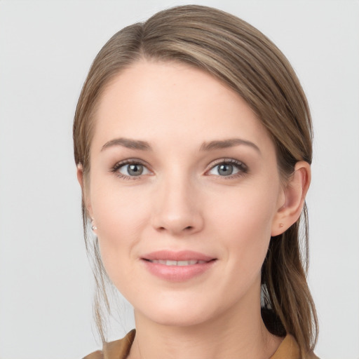 Joyful white young-adult female with long  brown hair and grey eyes