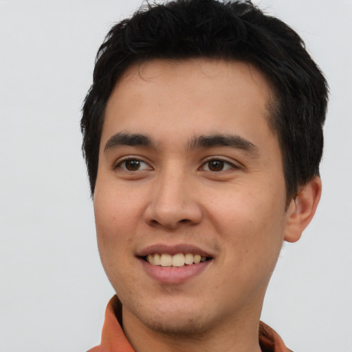 Joyful asian young-adult male with short  black hair and brown eyes