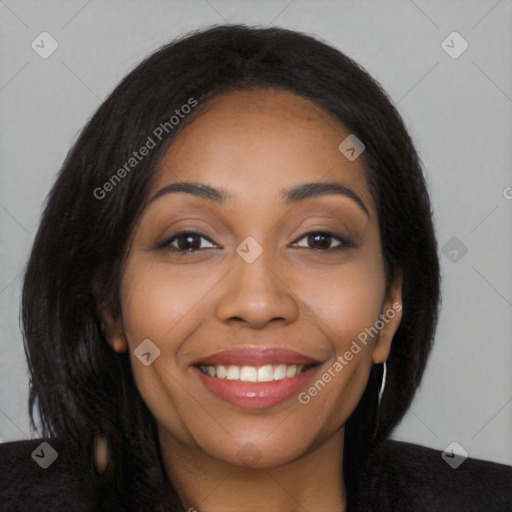 Joyful black young-adult female with long  black hair and brown eyes