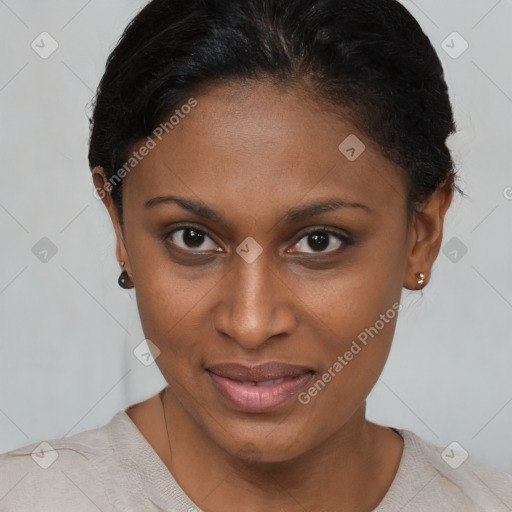 Joyful black young-adult female with short  brown hair and brown eyes