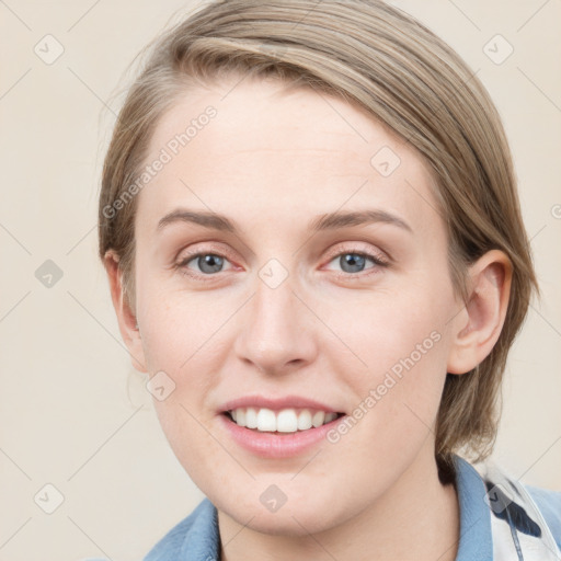 Joyful white young-adult female with medium  brown hair and blue eyes