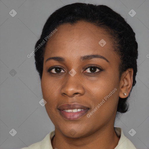 Joyful black young-adult female with short  black hair and brown eyes