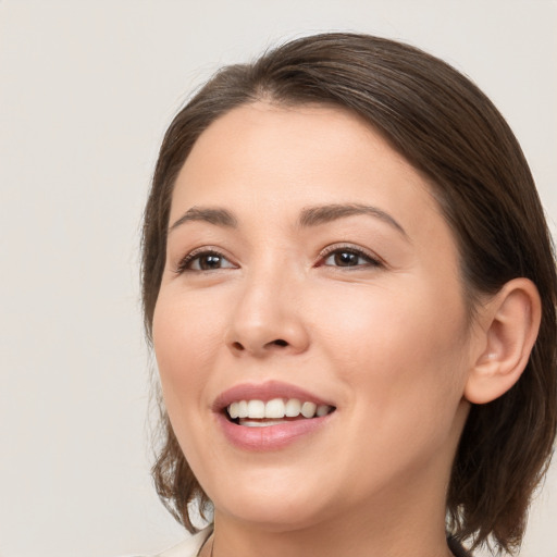 Joyful white young-adult female with medium  brown hair and brown eyes