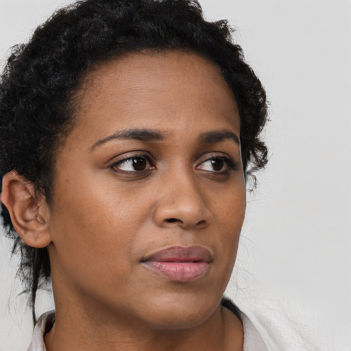 Neutral black young-adult female with short  brown hair and brown eyes