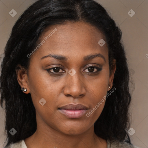 Joyful black young-adult female with long  brown hair and brown eyes