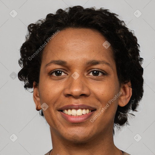 Joyful black adult female with short  brown hair and brown eyes