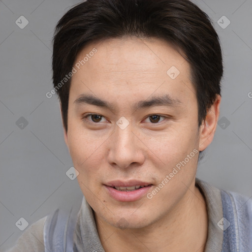 Joyful asian young-adult male with short  brown hair and brown eyes