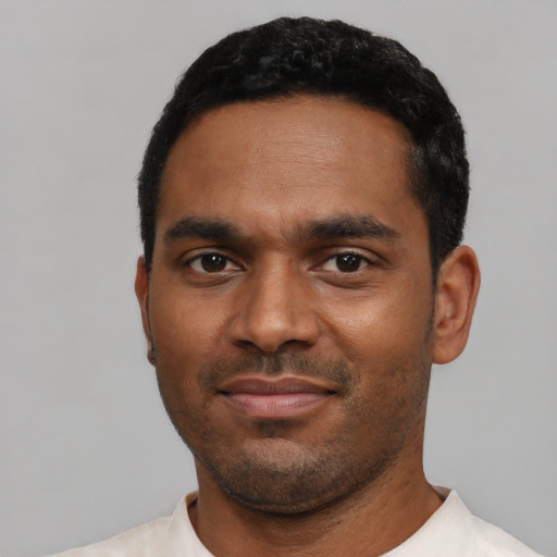 Neutral black young-adult male with short  black hair and brown eyes
