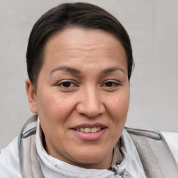 Joyful white adult female with short  brown hair and brown eyes