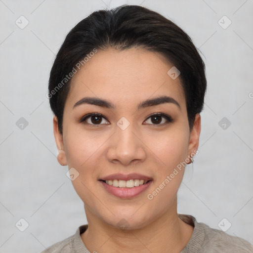 Joyful asian young-adult female with short  black hair and brown eyes