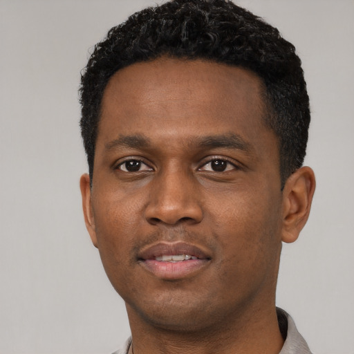 Neutral black young-adult male with short  black hair and brown eyes