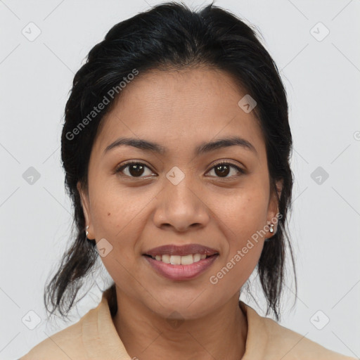 Joyful latino young-adult female with medium  brown hair and brown eyes