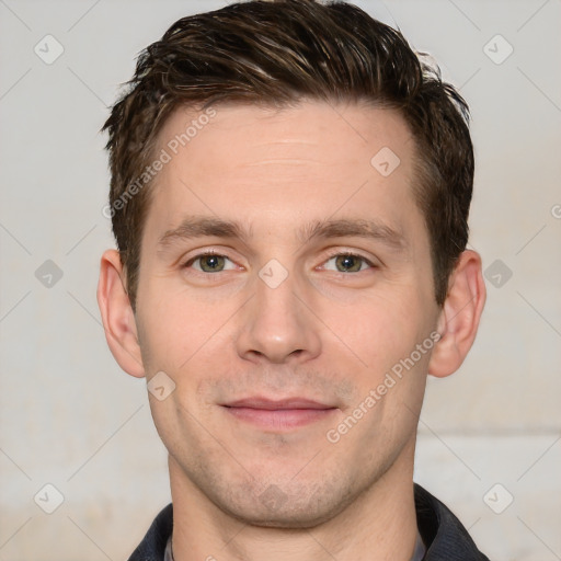 Joyful white adult male with short  brown hair and grey eyes