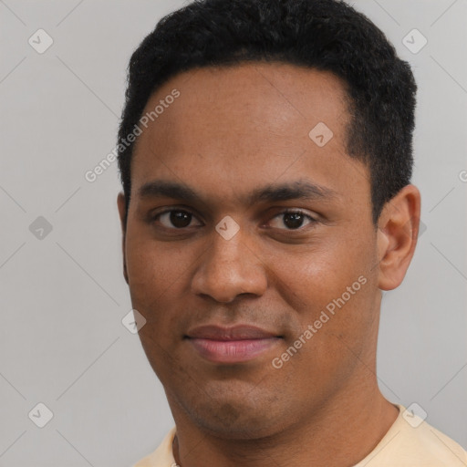 Joyful black young-adult male with short  black hair and brown eyes