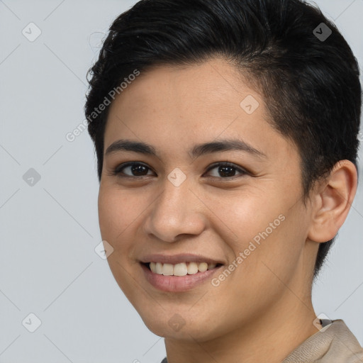 Joyful latino young-adult female with short  brown hair and brown eyes