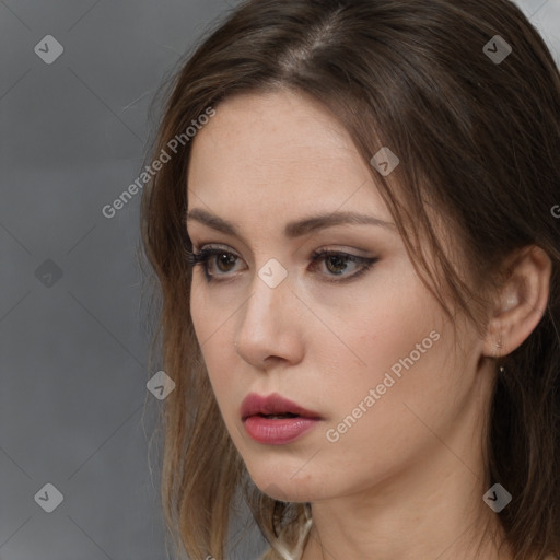 Neutral white young-adult female with long  brown hair and brown eyes