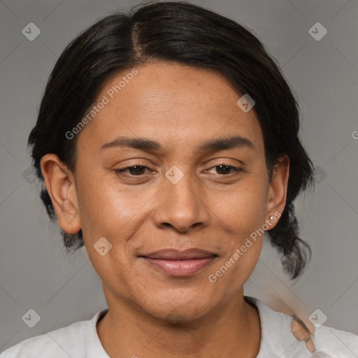 Joyful black adult female with medium  brown hair and brown eyes