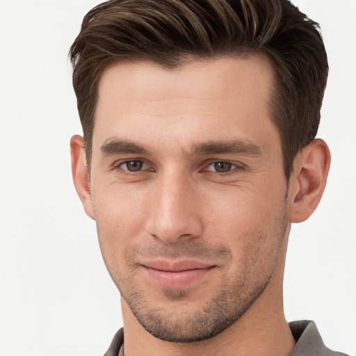 Joyful white young-adult male with short  brown hair and brown eyes