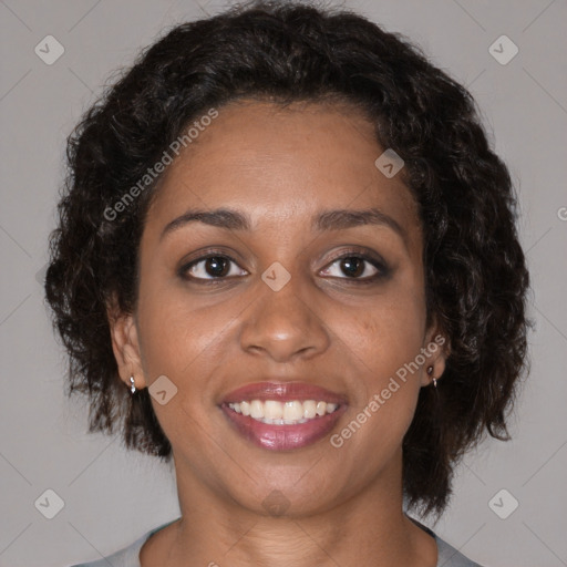 Joyful black young-adult female with medium  brown hair and brown eyes