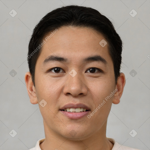 Joyful asian young-adult male with short  brown hair and brown eyes