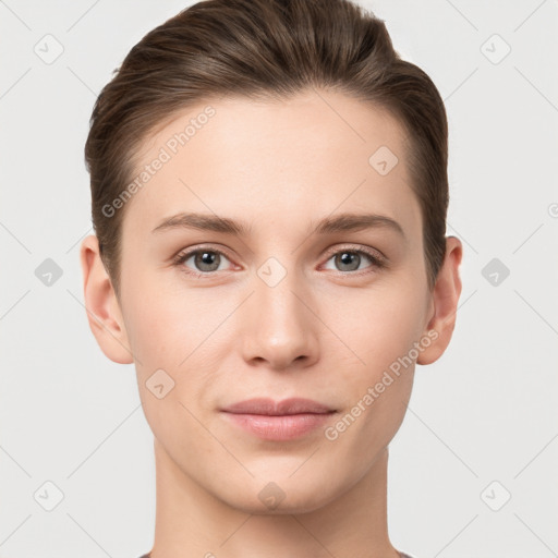 Joyful white young-adult female with short  brown hair and grey eyes