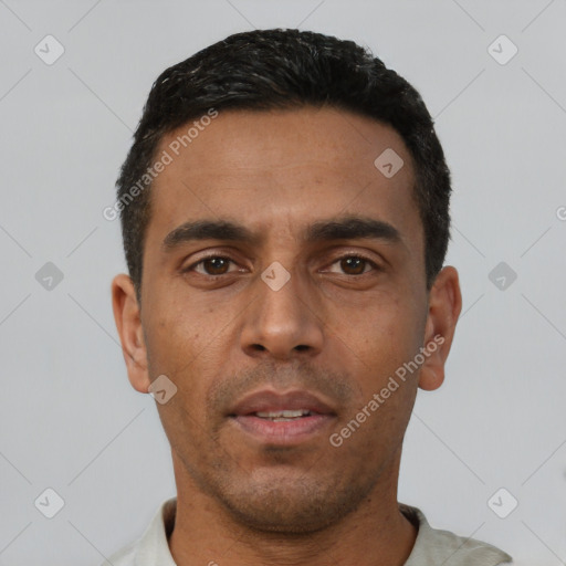 Neutral latino young-adult male with short  black hair and brown eyes