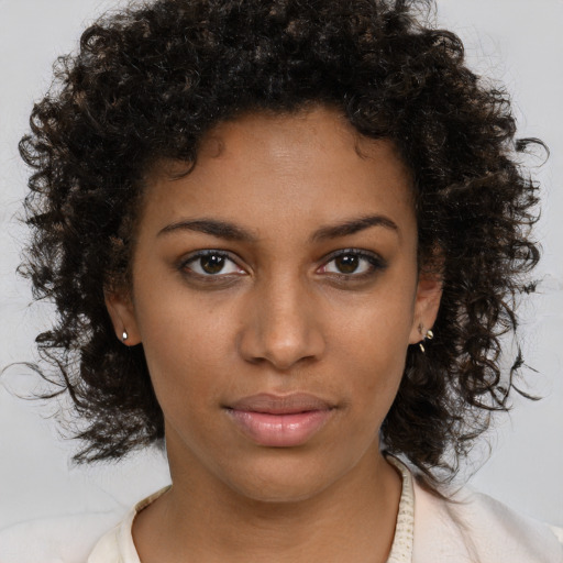 Neutral black young-adult female with medium  brown hair and brown eyes