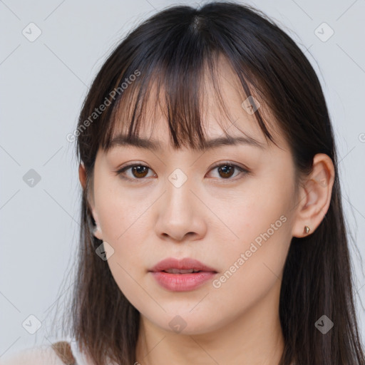 Neutral white young-adult female with long  brown hair and brown eyes