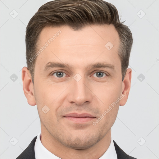 Joyful white adult male with short  brown hair and brown eyes