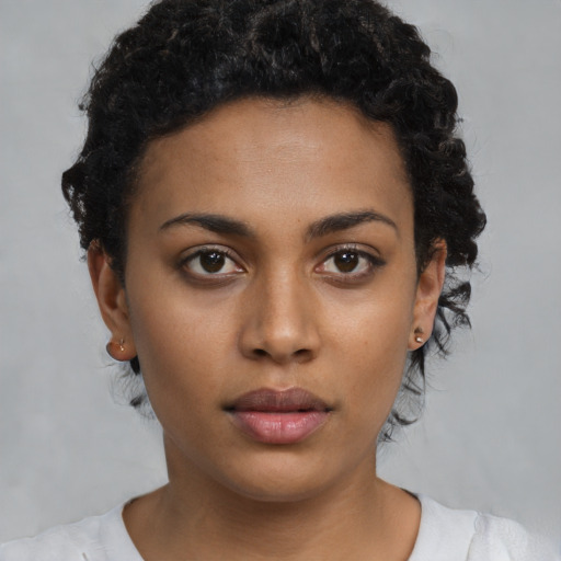 Neutral black young-adult female with short  brown hair and brown eyes