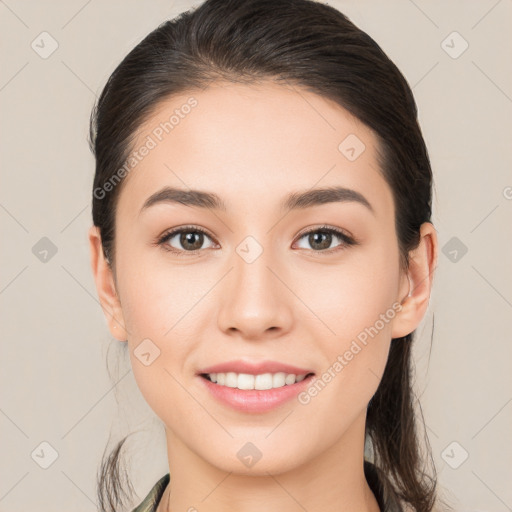 Joyful white young-adult female with medium  brown hair and brown eyes