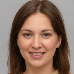 Joyful white young-adult female with medium  brown hair and brown eyes