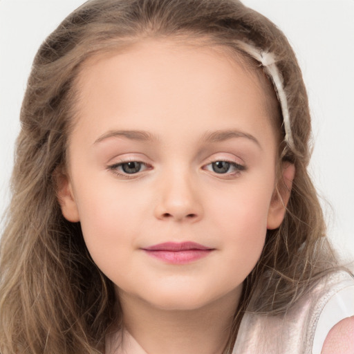 Joyful white child female with long  brown hair and brown eyes